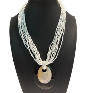 Source Unknown Multi-Strand White Necklace with Black and Cream Pendant